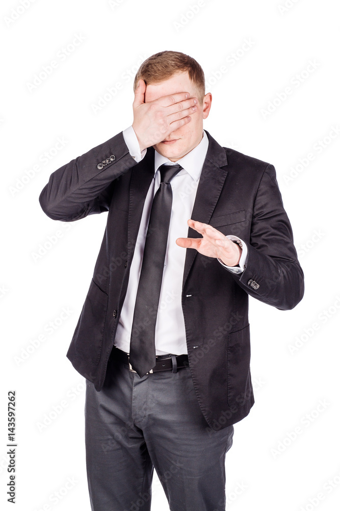 portrait young businessman covering his eyes with his hand. emotions, facial expressions, feelings, body language, signs. image on a white studio background. portrait young businessman covering his eyes with his hand. emotions, facial expressions, feelings, body language, signs. image on a white studio background.
