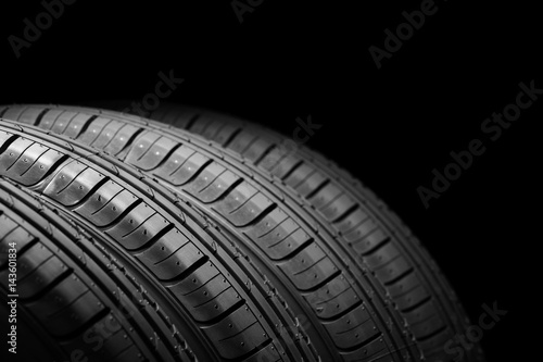 Car tires on black background © Ramil Gibadullin