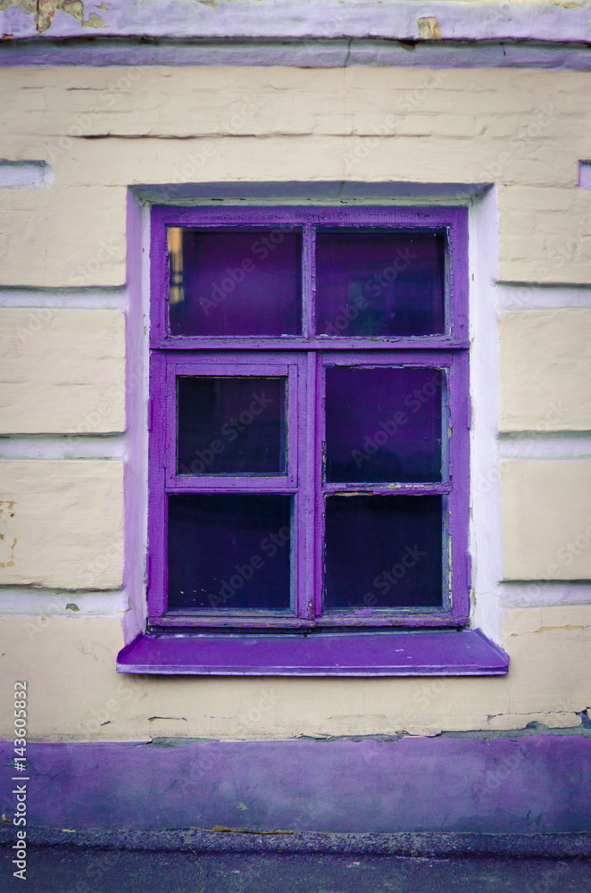 Fototapeta premium Window with purple frame on beige wall