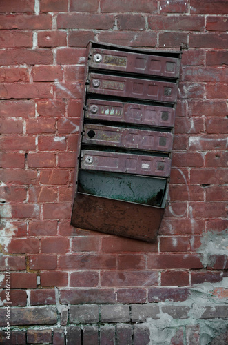 Old vintage metal made, traditional mailboxes / letter box.The old Soviet Inbox on a red brick wall