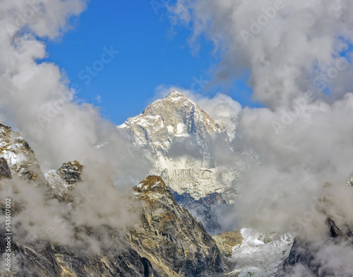 Mount Everest (8848 m) in the clouds. View from the Renjo Pass (5360 m) - Gokyo region, Nepal, Himalayas photo