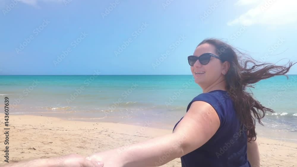 High quality video of happy Woman leading her boyfriend to the sea in real 1080p slow motion 120fps High quality video of happy Woman leading her boyfriend to the sea in real 1080p slow motion 120fps