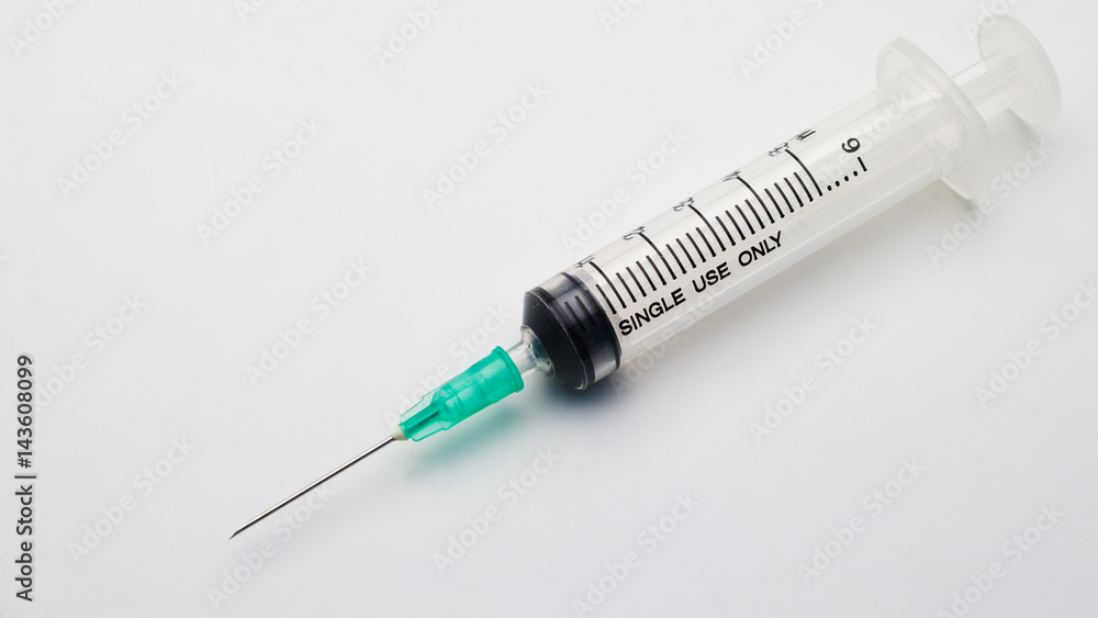 Close up used syringe on white background Close up used syringe on white background