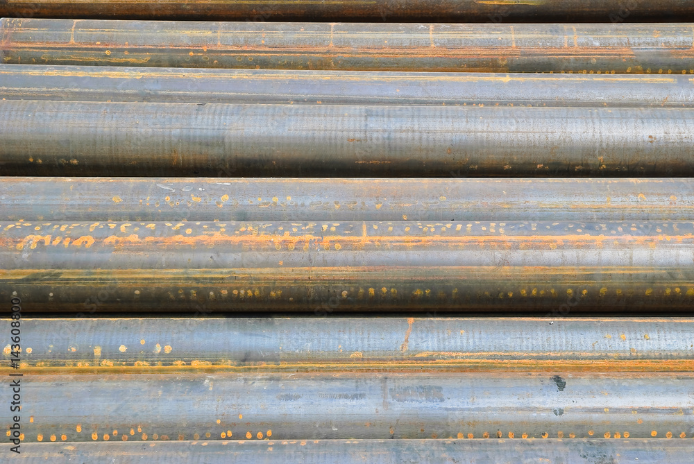 Metal pipes, stacked in a pile. Background, texture Metal pipes, stacked in a pile. Background, texture