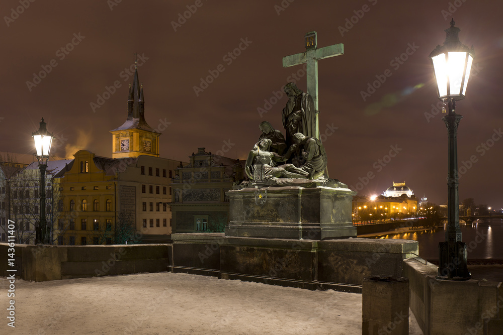 Night colorful snowy Prague Old Town with Sculptures from the Charles Bridge, Czech republic