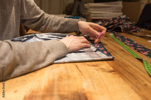 Girl sewing in a studio