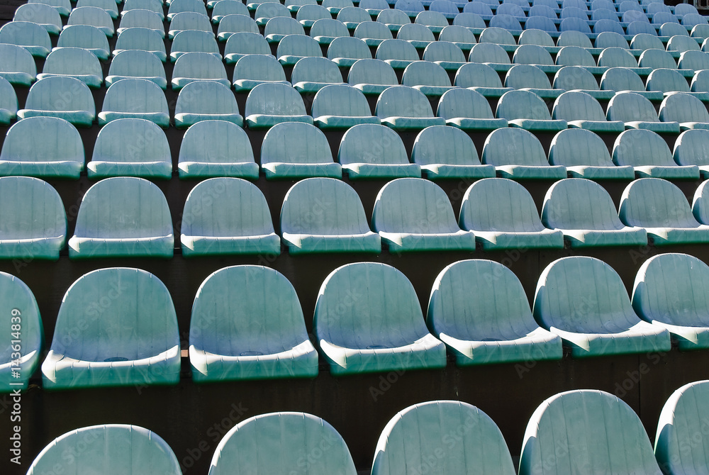 Fototapeta premium Rows of old theater chairs in the open air. Background