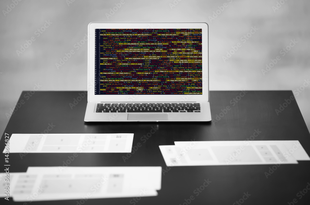 Fototapeta premium Laptop and documents on table in office