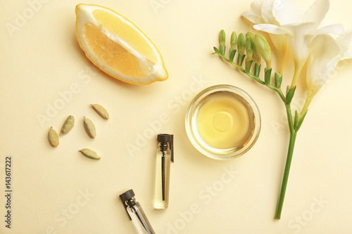 Beautiful composition with perfume samples on color background