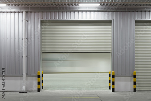 Roller door or roller shutter. Also called security door or security shutter with automatic system. For protection industrial building i.e. factory, warehouse, hangar, workshop, store, hall or garage.