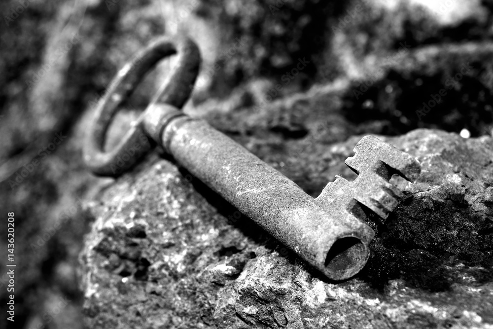 very old door key in rusty iron very old door key in rusty iron