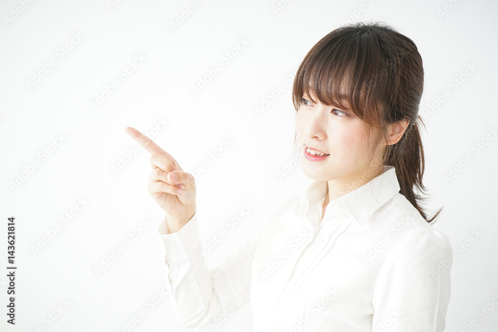 Young business woman pointing something with smile Young business woman pointing something with smile