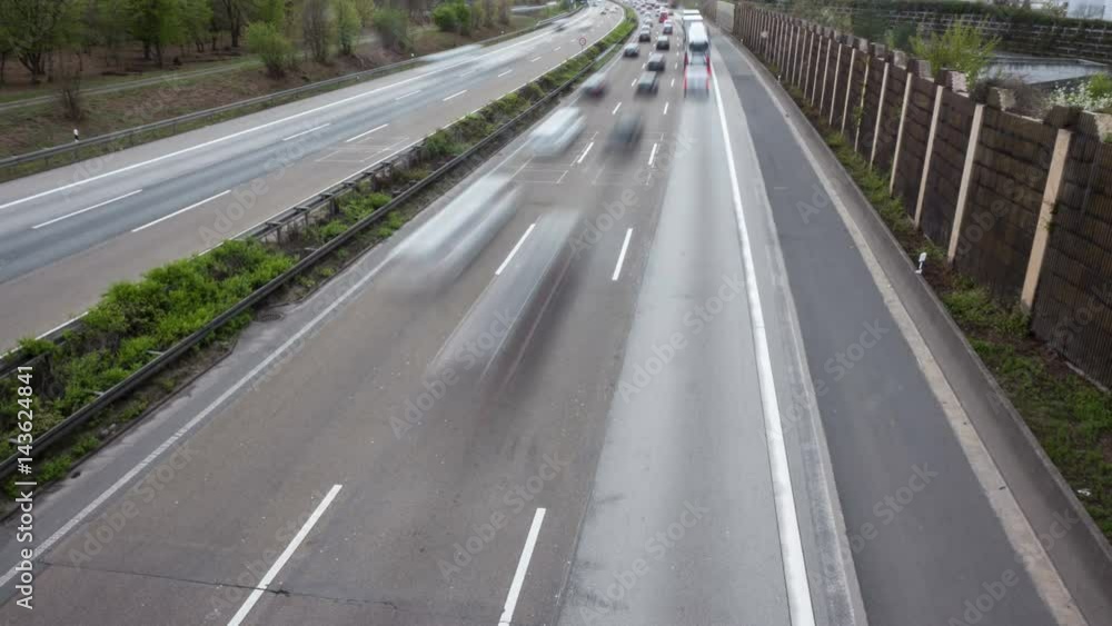 Dense traffic on German highway A3 at Frankfurt Airport. Time lapse Dense traffic on German highway A3 at Frankfurt Airport. Time lapse