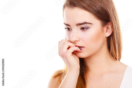 Teenage woman looking worried, thinking about something