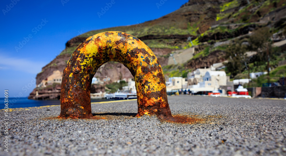 Fototapeta premium Santorini island, Greece - Rusty mooring at Fira port