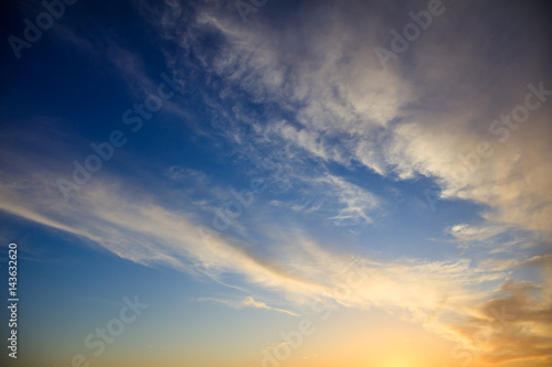 Fototapeta Naklejka Na Ścianę i Meble -  Blue sky, some clouds at sunset