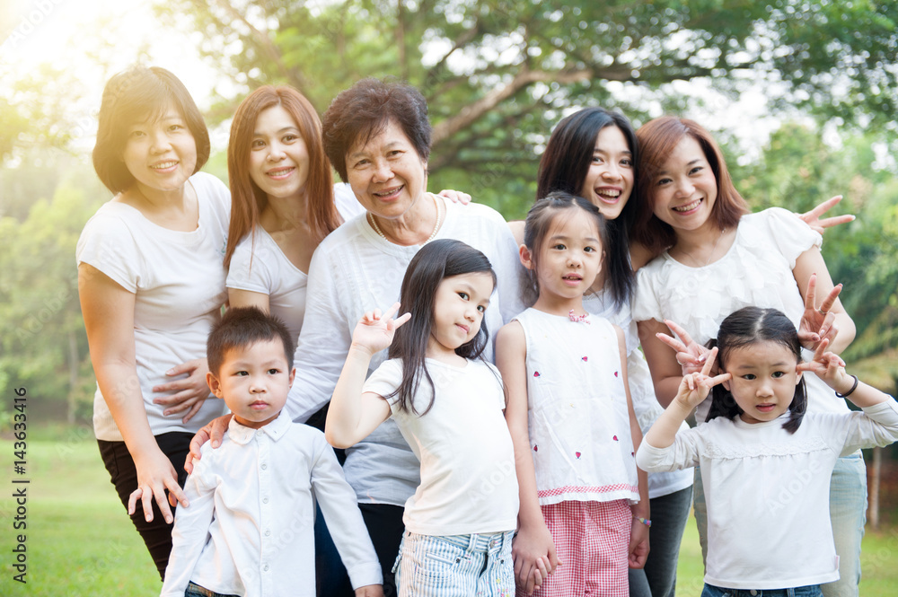 Group of Asian multi generations family outdoors Group of Asian multi generations family outdoors