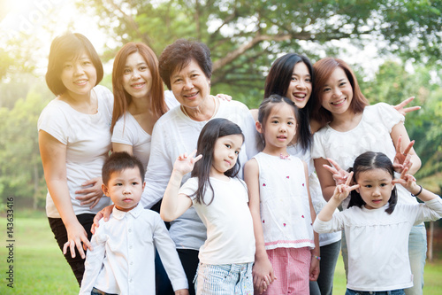 Group of Asian multi generations family outdoors