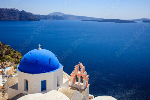 Fototapeta Naklejka Na Ścianę i Meble -  White church with blue dome in Santorini, Greece