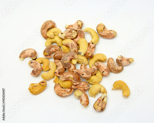 cashew nut with peel on white background