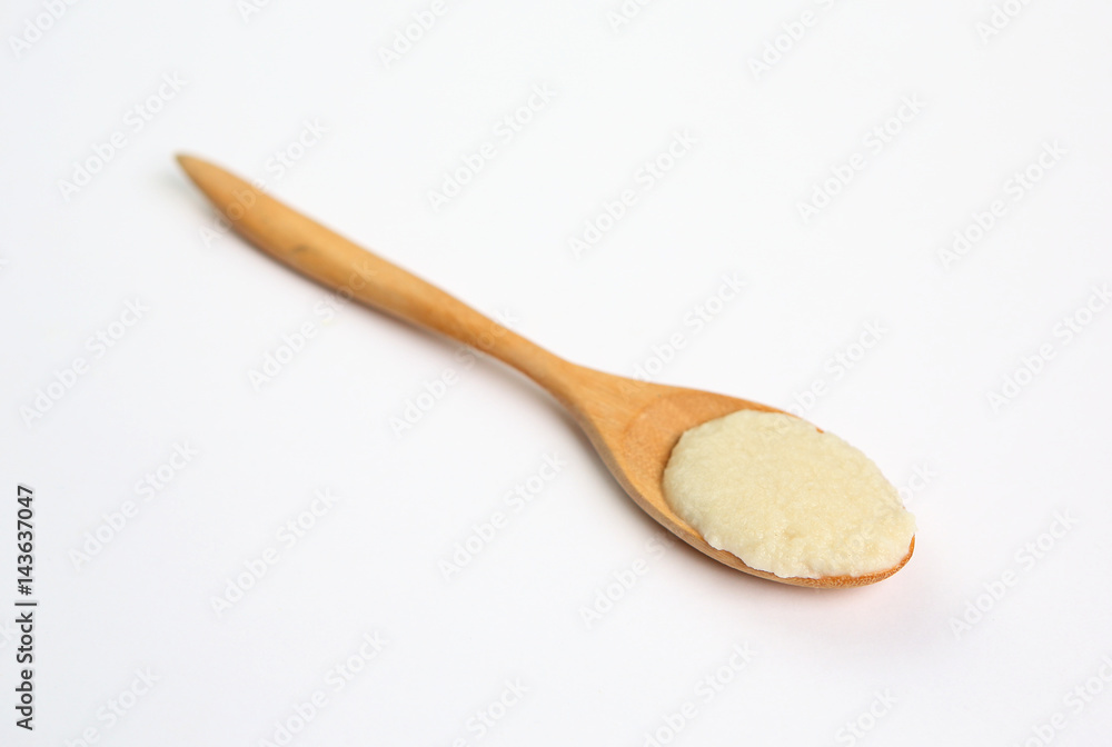 Cereal in wooden spoon over white background Cereal in wooden spoon over white background