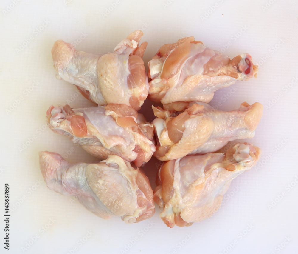 Raw chicken middle wing on a board Raw chicken middle wing on a board
