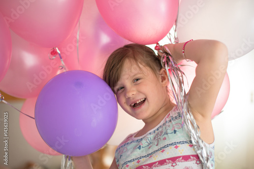 girl child rejoices with balloon concept childhood