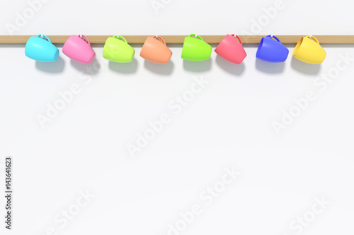 3D Rendering : illustration of cute colorful many ceramic coffee cups or drinking water glasses hanging on a wall background. set of colorful cups on a wall. close up