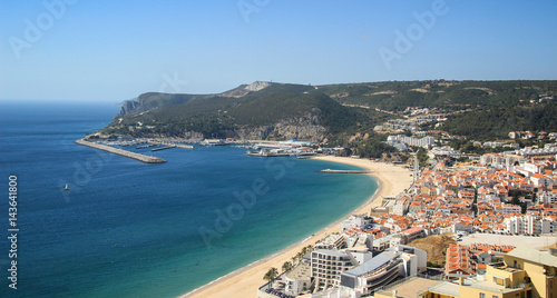 Beautiful view of Sesimbra beach in Portugal at the sunset