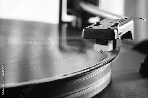 old pickup above the vinyl record. black and white image