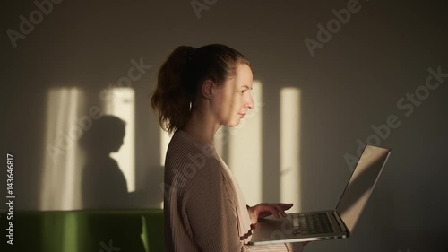 Girl using laptop Staying at Home befor the Train and Searching new Exercises 