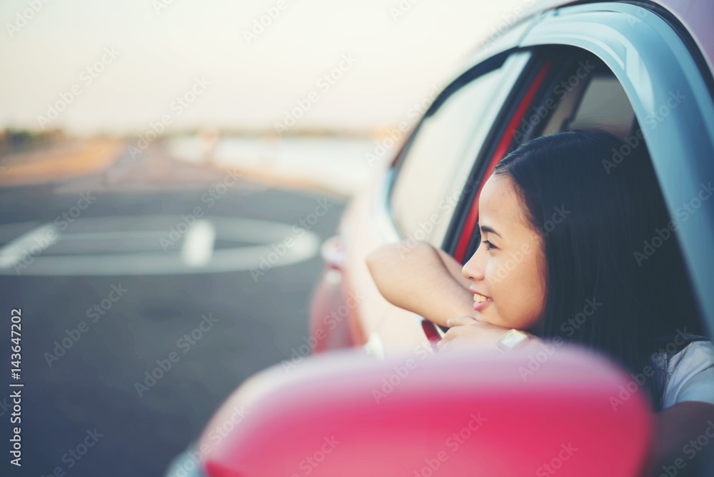 young woman happy and smaile in the car
