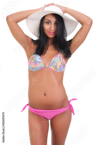 young woman in swimsuit and hat