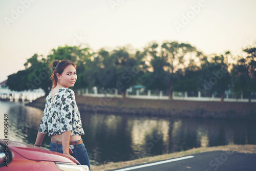 young woman sad and car at roadside and sunset time © stcom
