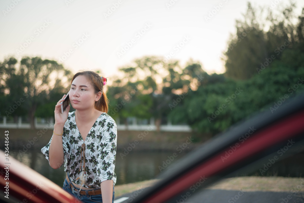 young woman phone calls after traffic accident