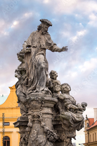 Sculpture of Saint Ivo in Prague - patron of beggars and poor people in the city photo