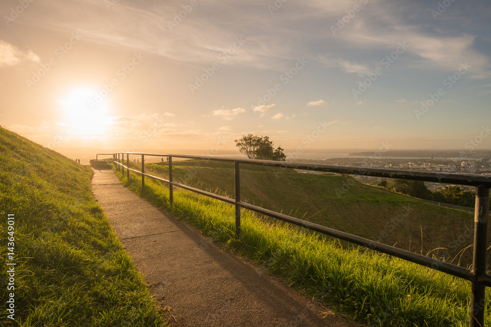 Sunset over the crater of Mount Eden volcano in Auckland, North Island, New Zealand.
