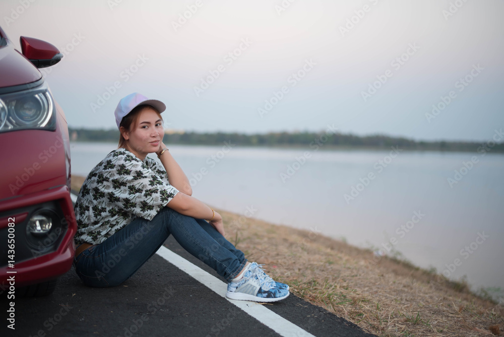young woman sad and car at roadside and sunset time young woman sad and car at roadside and sunset time