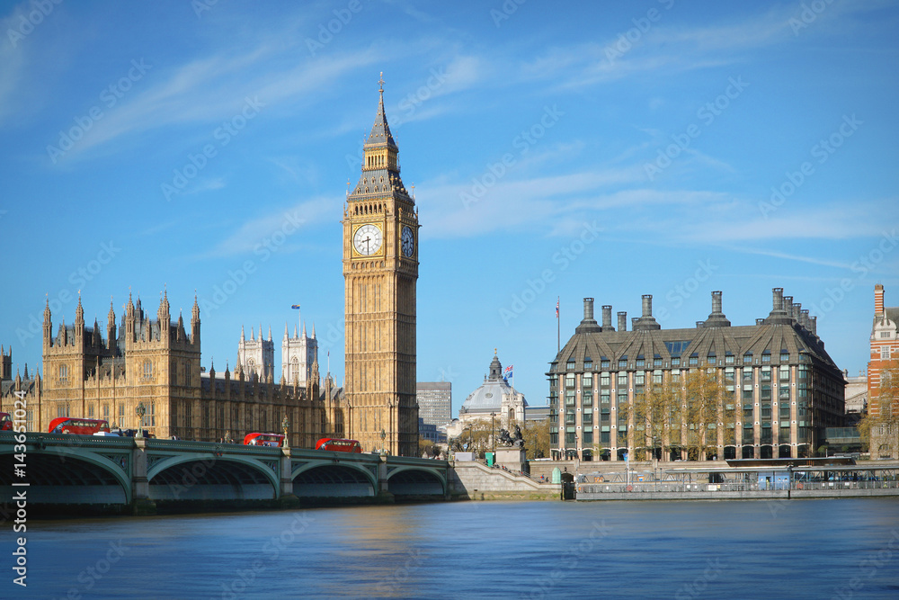 London, UK. Big Ben and the Westminster Bridge with Red buses.