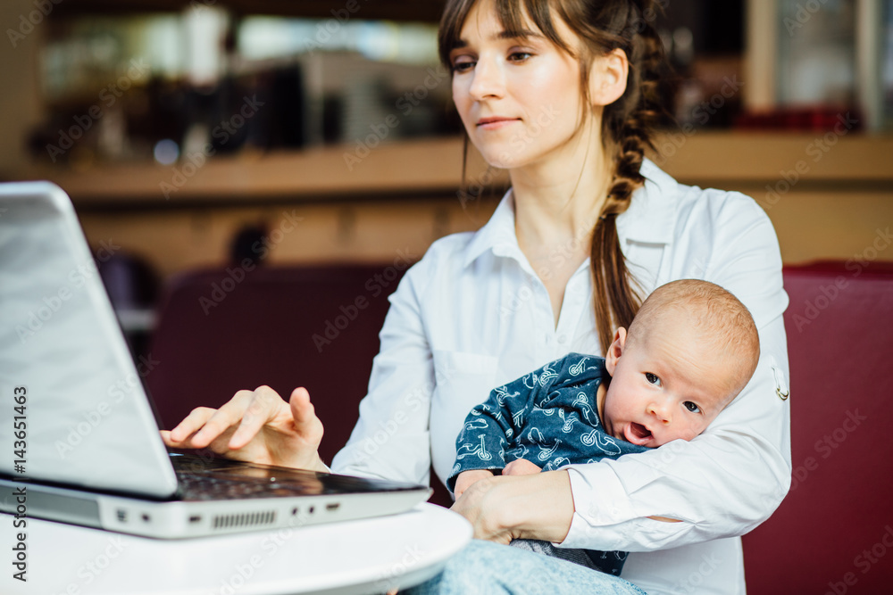 business, motherhood, multi-tasking, family and people concept - happy businesswoman with baby and tablet computer working at table of cafe. business, motherhood, multi-tasking, family and people concept - happy businesswoman with baby and tablet computer working at table of cafe.