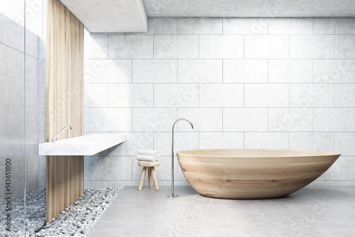 Gray brick bathroom  wooden tub  front