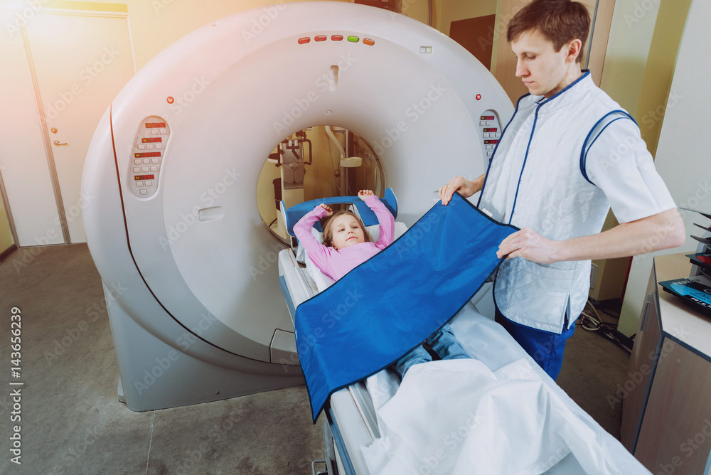 Medical equipment. Doctor and patient in the room of computed tomography Medical equipment. Doctor and patient in the room of computed tomography