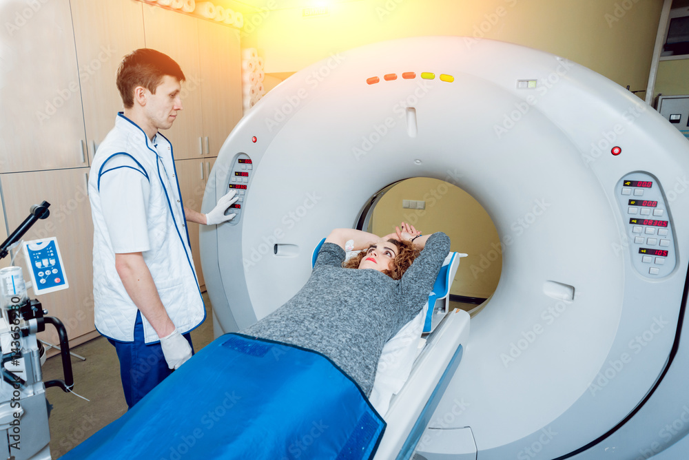 Medical equipment. Doctor and patient in the room of computed tomography Medical equipment. Doctor and patient in the room of computed tomography