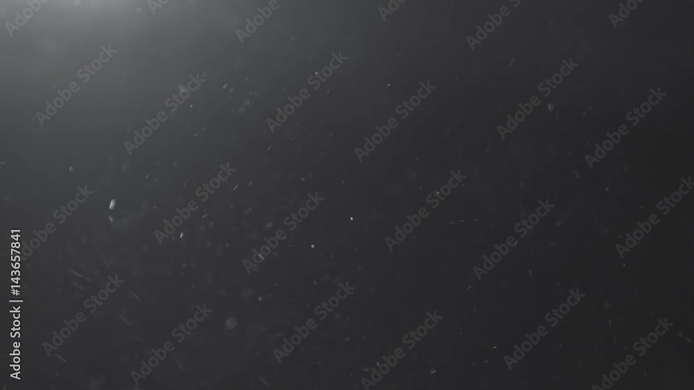 Slow motion of dust particles with light flare from above fly in the air, 180fps prores footage Slow motion of dust particles with light flare from above fly in the air, 180fps prores footage