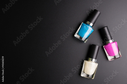 Nail polisher isolated on black background, Cosmetics concept, Makeup concept, Copy space image for your text, Flat lay.