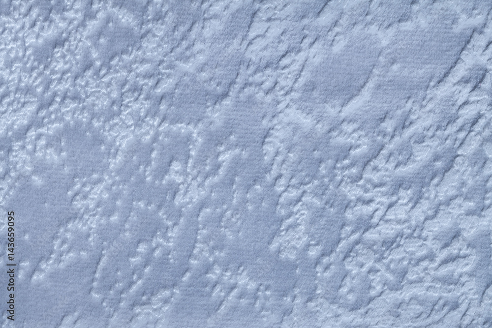 Obraz premium Light blue background from a soft upholstery textile material, closeup.
