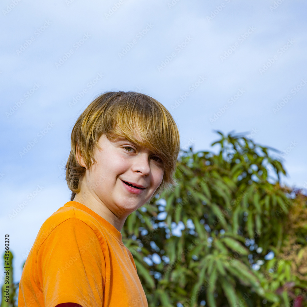 happy boy smiling under blue sky happy boy smiling under blue sky