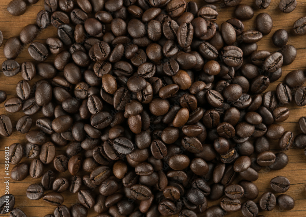 coffee beans on table wood background coffee beans on table wood background
