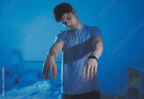 Photos Young sleepy man suffering from somnambulism at home