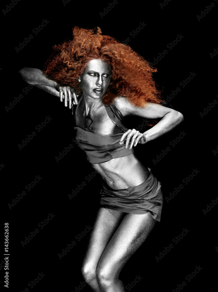 Beautiful young woman with amazing body-art as lion on dark background. Zodiac signs concept Beautiful young woman with amazing body-art as lion on dark background. Zodiac signs concept